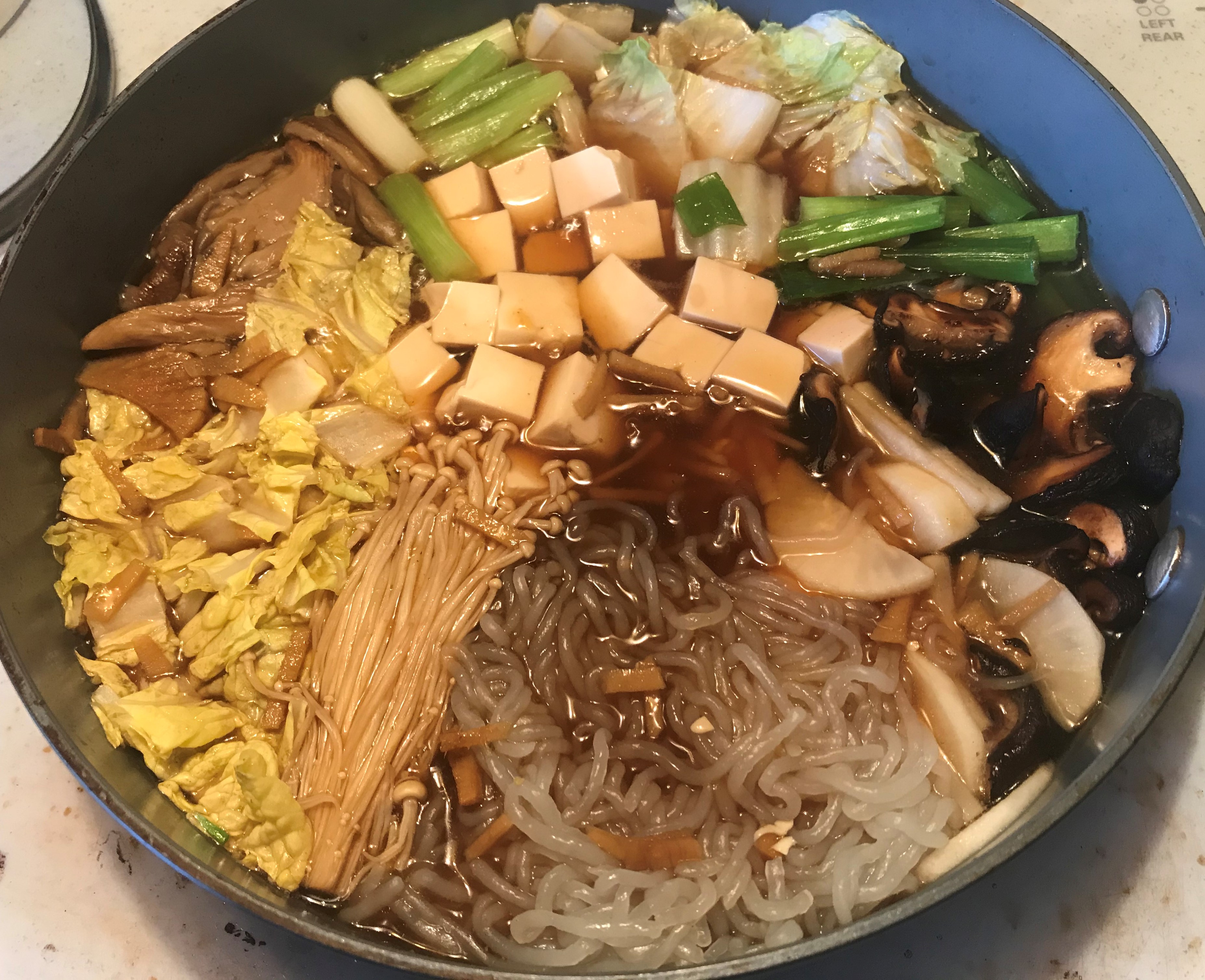 Sukiyaki: Japanese hot pot with beef, tofu, rice noodles and vegetables